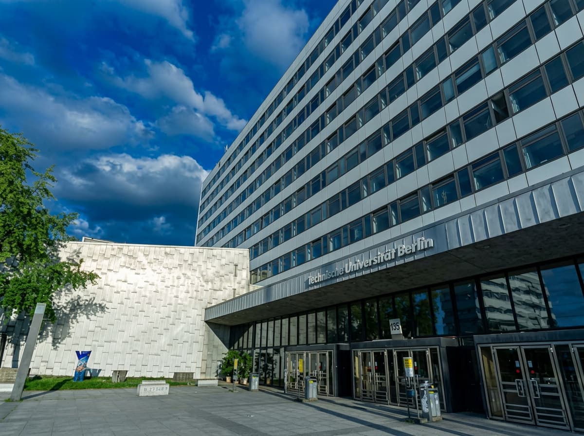 A student outside a modern German university.