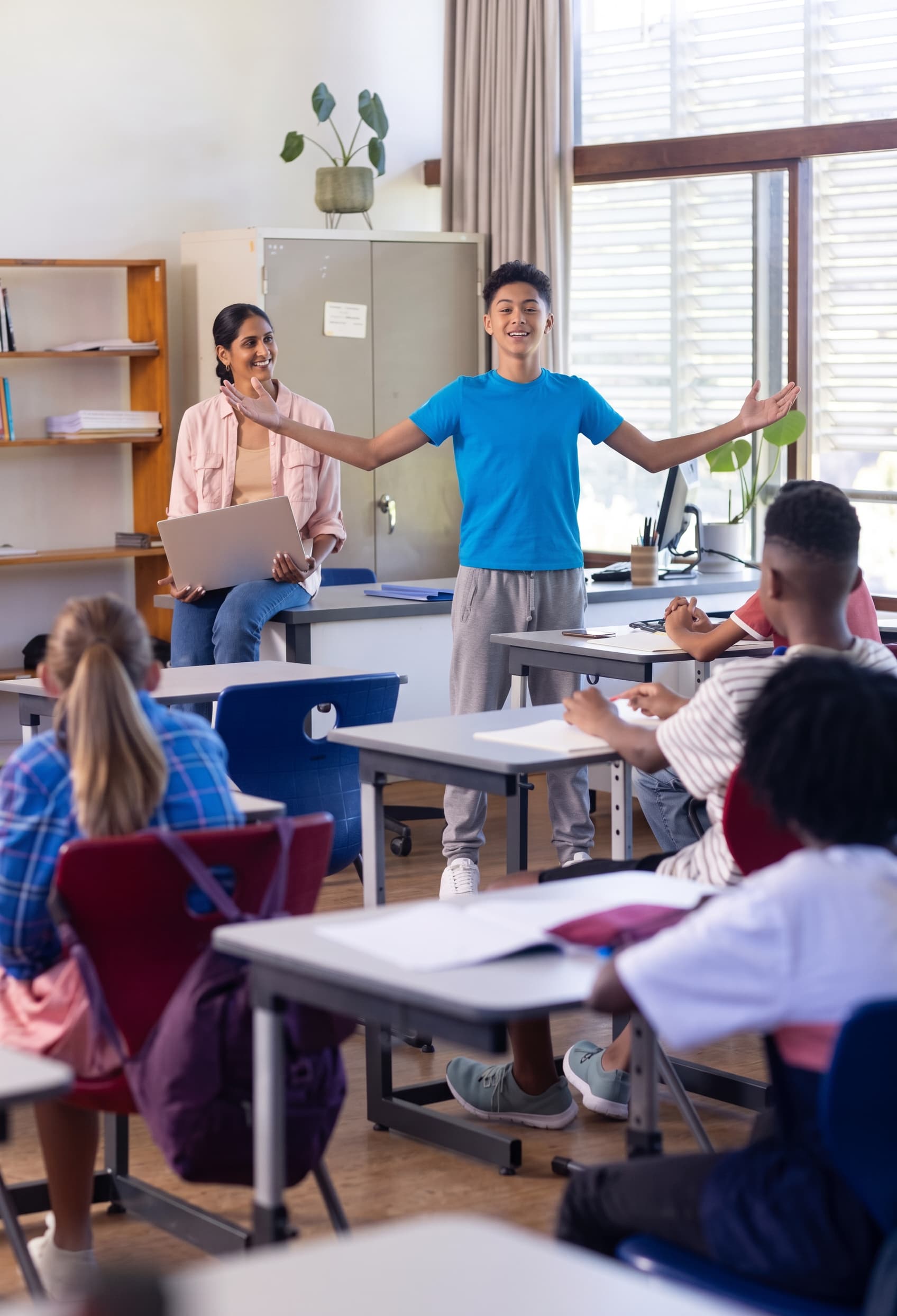 A teacher and students working together during a classroom session.